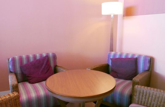 Cafe indoor furnitures with purple cushions