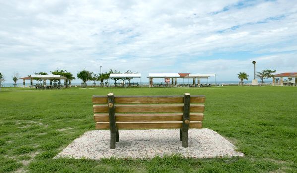 Wooden garden bench in the park