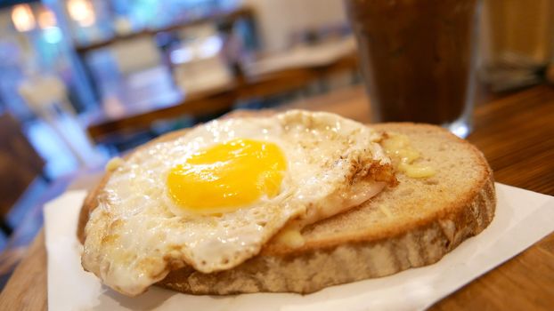 Breakfast sun egg bread with cold drink on the wooden table