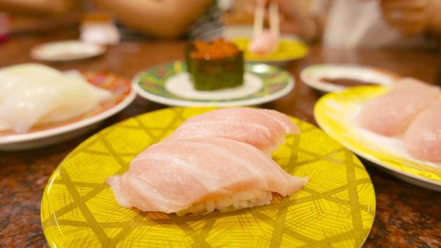 The KAMASU NIGIRI sushi on white dish in Japanese restaurant