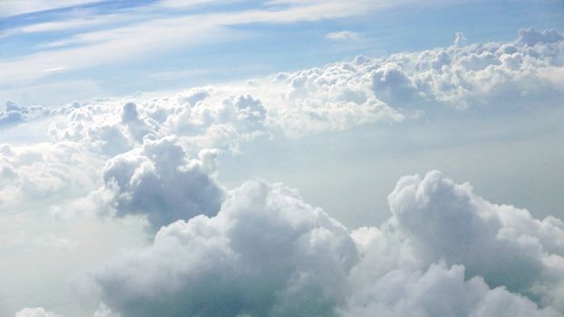 Nice natural clouds in the blue sky from aerial view