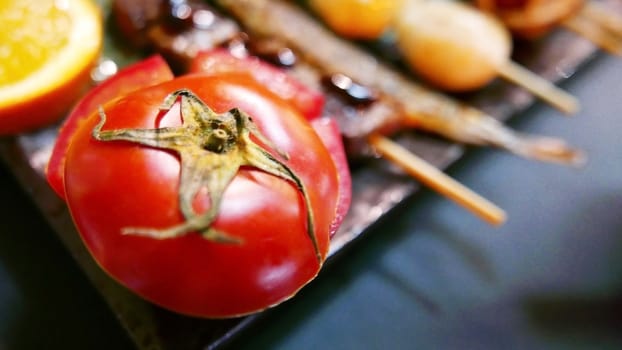 Cooked red tomato on the dish