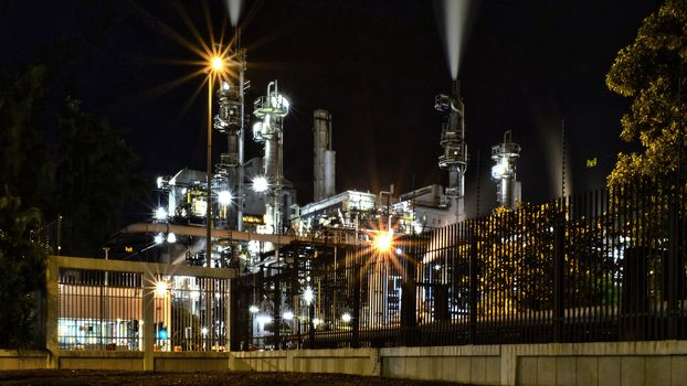 Oil refinery building at night time