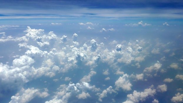 white fluffy clouds in the clean blue sky