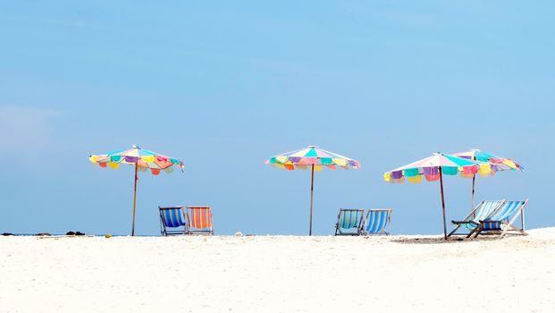 Suntanning umbrella and chair on the beach