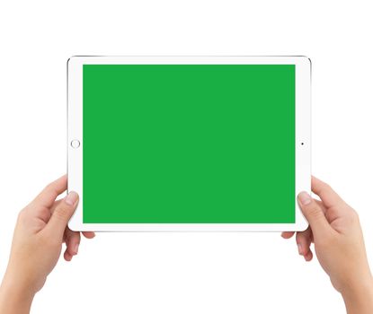 Isolated human two hands holding white tablet computer green screen mockup on white background