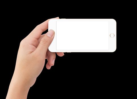 Isolated human left hand holding white mobile smart phone mockup on black background