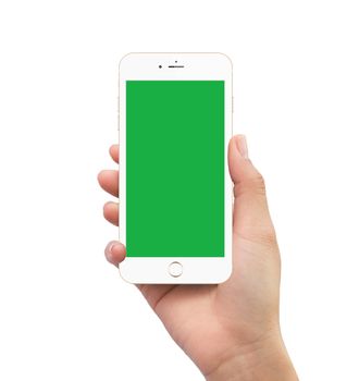 Isolated human hand holding green screen white mobile smart phone mockup on white background
