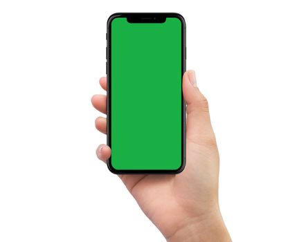 Isolated Isolated human right hand holding black mobile smartphone with green screen