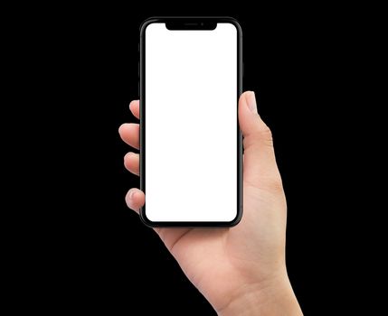 Isolated Isolated human right hand holding black mobile smartphone on black background