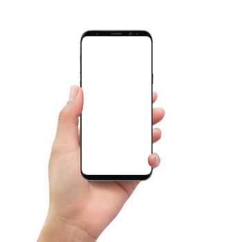 Isolated human left hand holding black mobile white screen smart phone mockup on black background