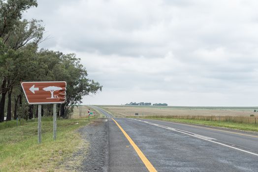 A damaged rest area road sign on road N5 near Winburg
