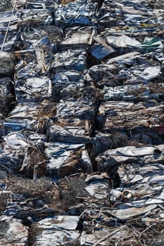 A garbage trash packs on a railway freight cars.