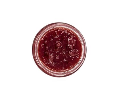 Jar of strawberry jam. Jar of strawberry jam top view on a white background macro