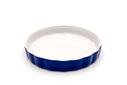 Blue porcelain ramekin on a white background
