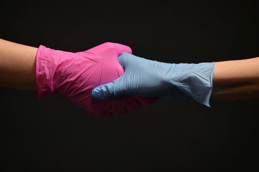Man And Doctor Holding Hands Wearing Medical Gloves Protection