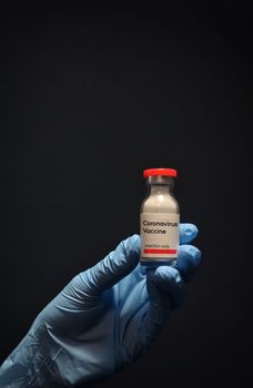 Woman Hand With Glove Holding Coronavirus Vaccine