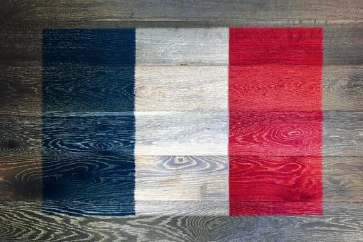 A France flag on rustic old wood surface background