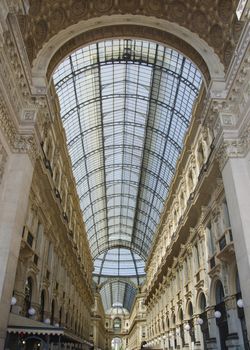 Unique view of Galleria Vittorio Emanuele II seen from above in Milan in summer. Built in 1875 this gallery is one of the most popular shopping areas in Milan