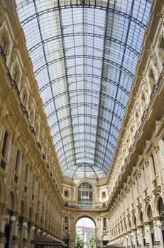 Unique view of Galleria Vittorio Emanuele II seen from above in Milan in summer. Built in 1875 this gallery is one of the most popular shopping areas in Milan
