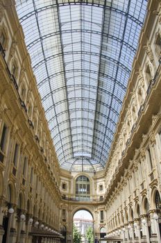 Unique view of Galleria Vittorio Emanuele II seen from above in Milan in summer. Built in 1875 this gallery is one of the most popular shopping areas in Milan