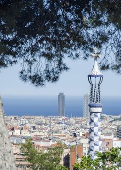 Top view of picturesque Barcelona cityscape in sunny day. Panoramic view of Barcelona from Park Guell in a summer day in Spain