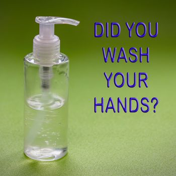 A text reminding you of hygiene. Alcohol-based hand sanitizer gel for fighting bacteria and viruses for hand washing to prevent COVID-19 virus. Green background.