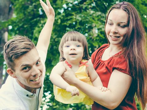 Family having fun at park in summer