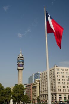 Santiago de Chile. Chile. January 15, 2012: Entel Tower and flag of Chile in the Libertador Bernardo O'Higgins Avenue.
