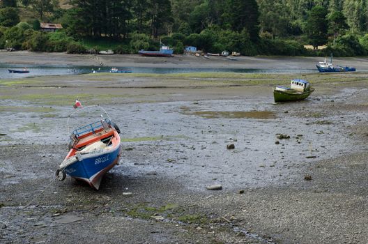Angelmo in Puerto Montt. Los Lagos Region. Chile. January 26, 2012: fishing boats stranded.