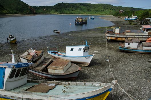 Puerto Montt. Los Lagos Region. Chile. January 26, 2012: fishing boats stranded in the Angelmo district.