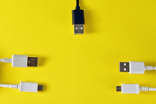 usb cables to transmit data on yellow background