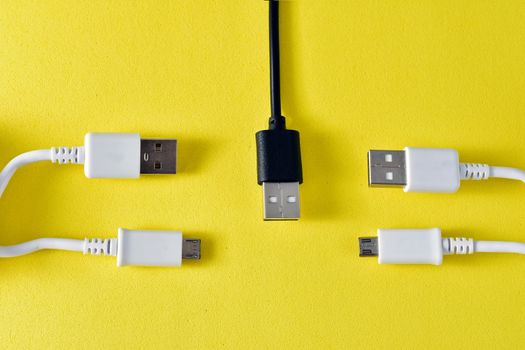 usb cables to transmit data on yellow background