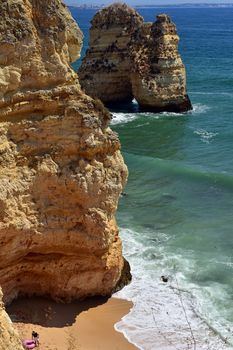 cliffs and rock formations on the coast of ponta da piedade in portugal