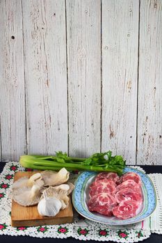 sliced raw lamb neck and mushrooms