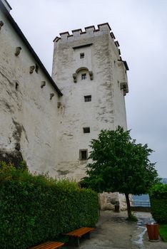 Salzburg, Austira -  August 16, 2010:  Medieval Hohensalzburg Castle (Festung Hohensalzburg) in morning fog, Salzburger Land, Austria.