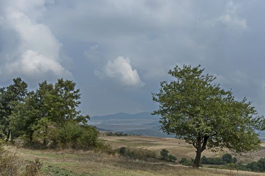 Amazing autumn view of glade, peak and deciduous trees  in Sredna gora mountain, Bulgaria