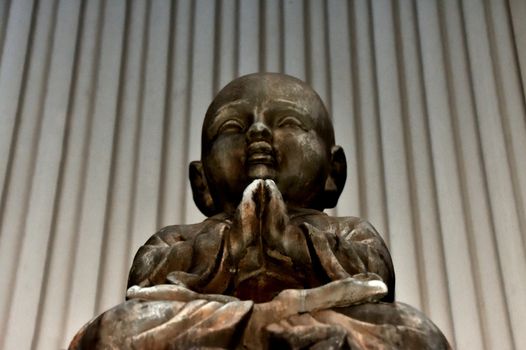 A statue of a young Buddha