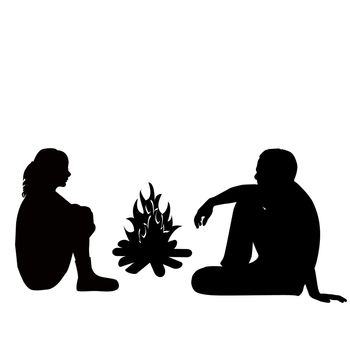 Silhouette of a man and woman sitting by the fire