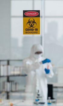 Photos taken through the glass of the lab room preventing the spread of virus research.