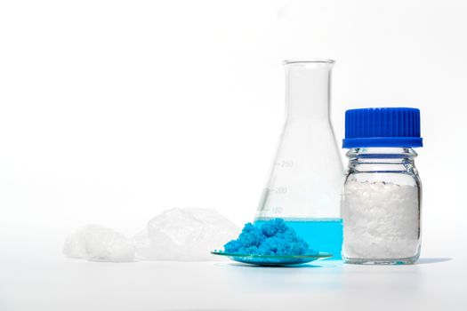 Inorganic chemical on white laboratory table. Copper(II) sulfate, Microcrystalline wax, Nickle Chloride, alcohol. Chemical ingredient for Cosmetics & Toiletries product.