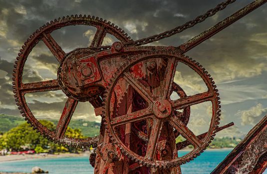 An old rusty, red crane on the island of St Croix