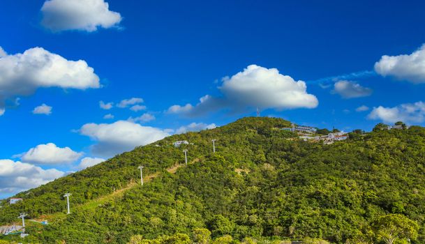 Skylift up green hills over St Thomas