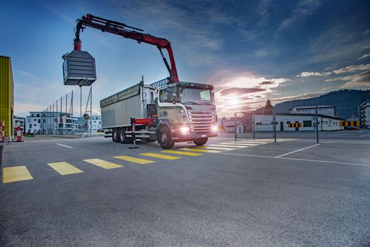 truck with crane emtying recycle. Green planet