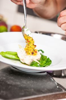 lifestyle cook presenting food in a white plate