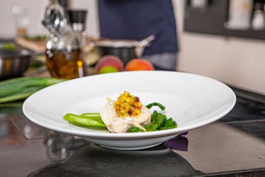 lifestyle cook presenting food in a white plate