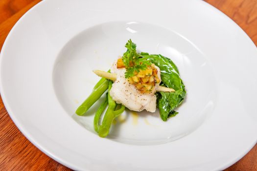 lifestyle cook presenting food in a white plate