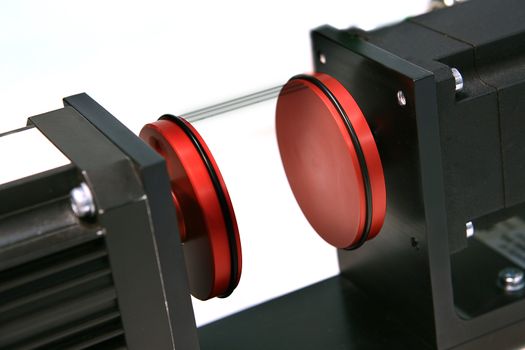 lathe spinning at high speed with two red end plates