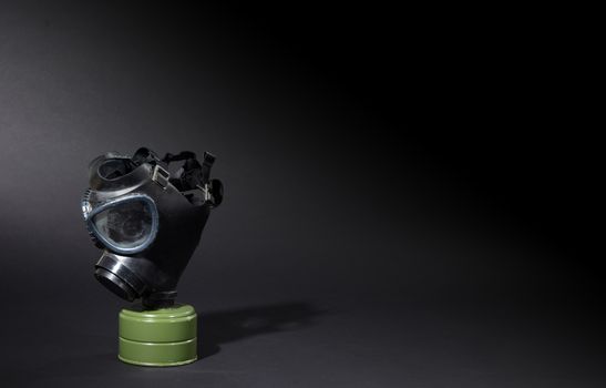 Vintage gasmask isolated on black background - Green filter