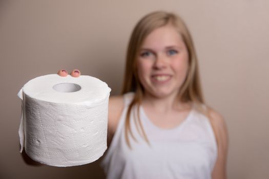 prepared for the shortage this girl holds out toilet paper